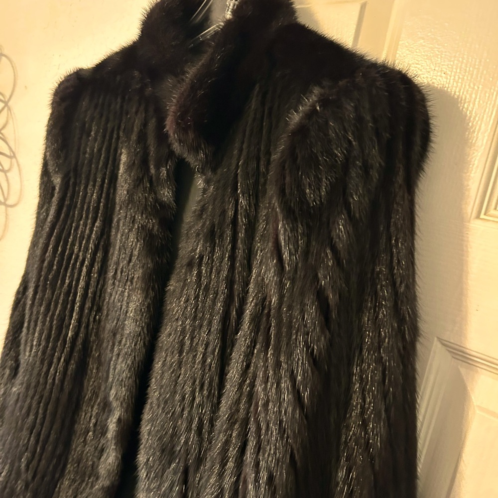 Black Mink jacket.  No size tag,  I am a large and can wear it.